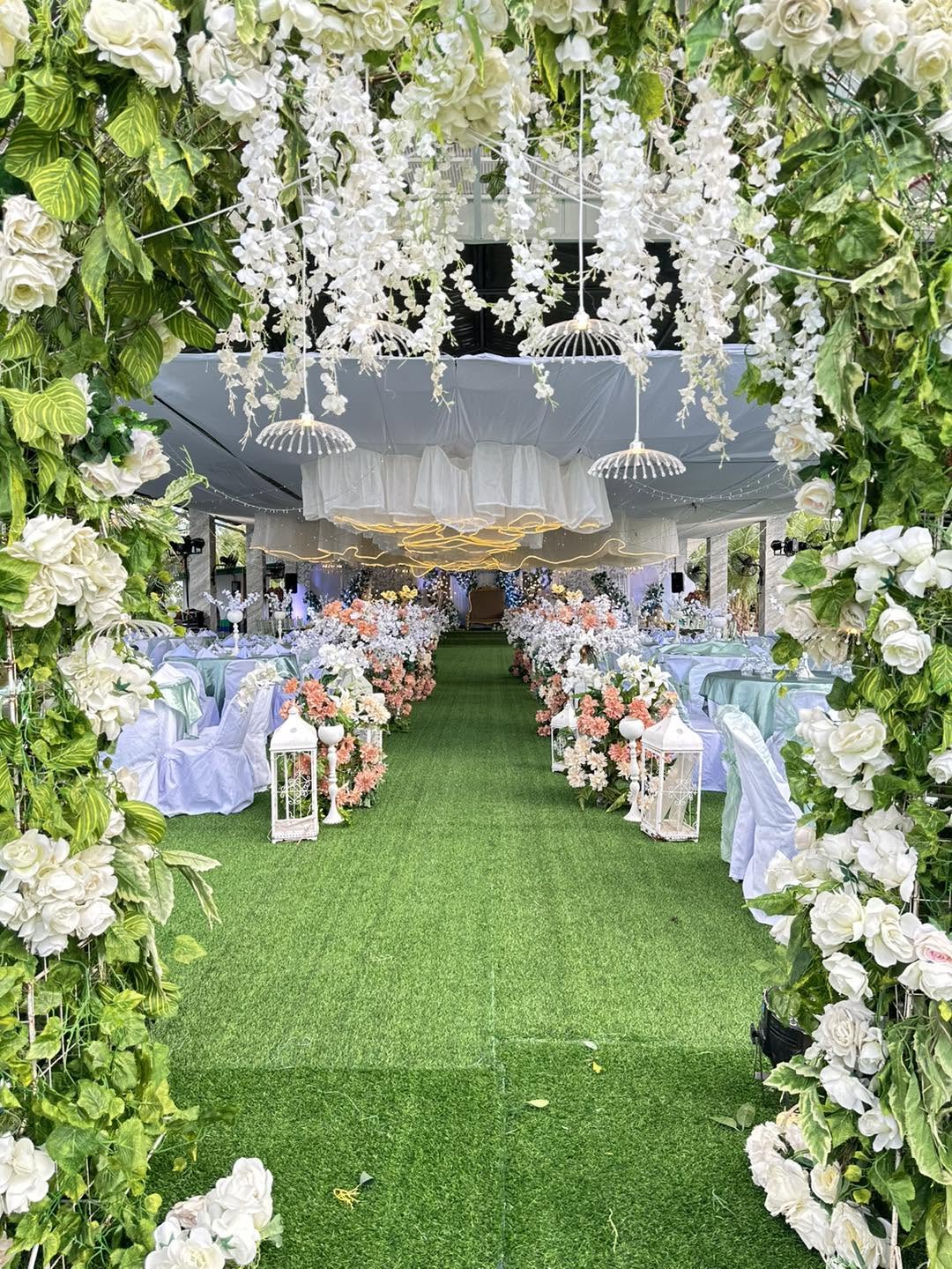 Floral entrance into a decorated celebration venue